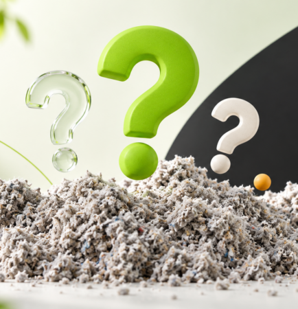 Trois points d’interrogation au-dessus de ouate de cellulose en vrac.